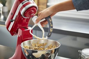 Close-up of KitchenAid KFE5T Flex Edge Beater showcasing its flexible edge for smoother mixing.
