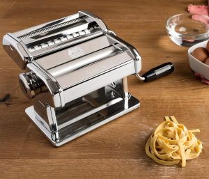 Chrome steel Atlas 150 pasta maker producing fettuccine and lasagna sheets