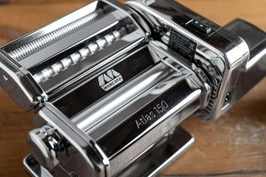 Complete Marcato Atlas 150 pasta maker set with clamp, Pastadrive motor, and accessories
