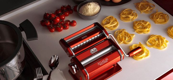 Marcato Atlas 150 pasta machine shining on a kitchen counter with fresh pasta.
