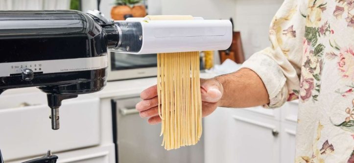 Chef and home cook using top-rated pasta machines in a contemporary kitchen.