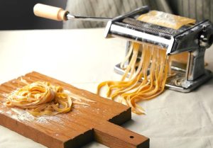 Step-by-step guide showing safe techniques to clean a pasta maker.