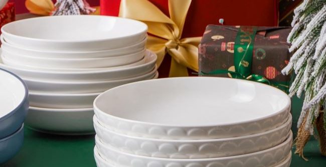 DOWAN 54 oz white ceramic pasta bowl with textured motif displayed on a kitchen table