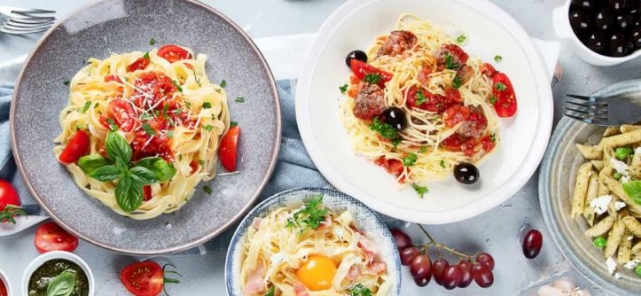 Assortment of international pasta dishes representing global flavors and recipes.