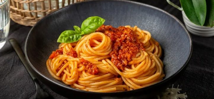 A variety of pasta dishes from different cultures on a dining table.