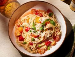 Classic Italian pasta dishes like spaghetti carbonara and lasagna served on a table.