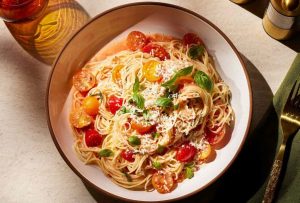 Classic Italian pasta dishes like spaghetti carbonara and lasagna served on a table.