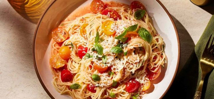 Classic Italian pasta dishes like spaghetti carbonara and lasagna served on a table.