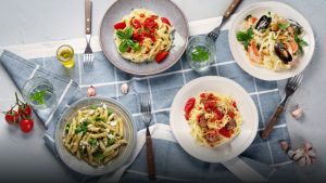 Assorted international pasta dishes representing global culinary traditions.