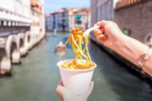 Variety of pasta dishes from around the world featured on a table.