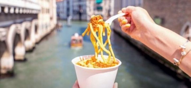 Variety of pasta dishes from around the world featured on a table.