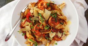Close-up of Asian fusion pasta dish combining noodles with Asian flavors.