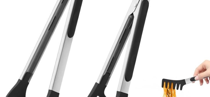 Stainless steel pasta fork lifting cooked spaghetti from pot in modern kitchen.