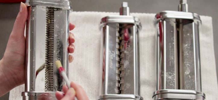 Cleaning a Marcato pasta machine after use in a kitchen for proper maintenance