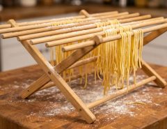 Cleaning a bamboo pasta drying rack with a soft cloth