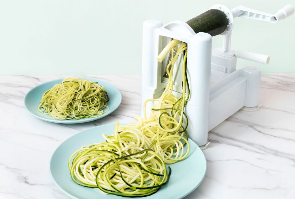 Close-up of spiralized zucchini noodles in a bowl ready for cooking or salad