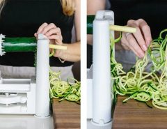 Kitchen scene showing spiralizer tool preparing low-carb zucchini pasta strands
