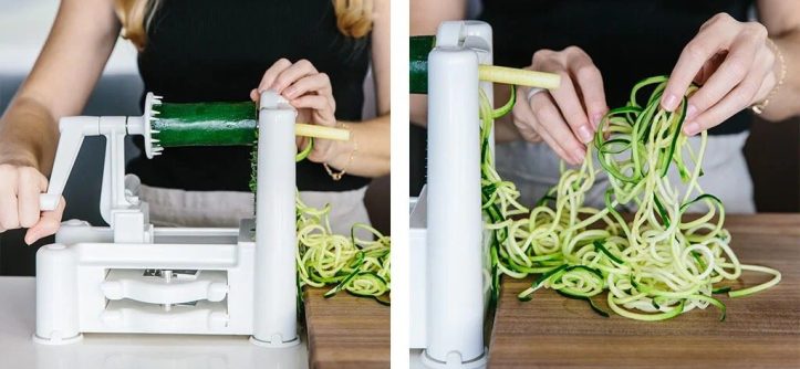 Kitchen scene showing spiralizer tool preparing low-carb zucchini pasta strands