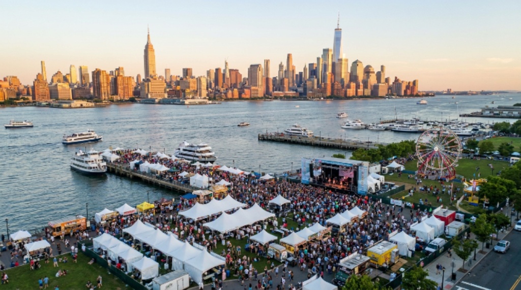 Aerial view of Hoboken waterfront festival grounds with Manhattan skyline